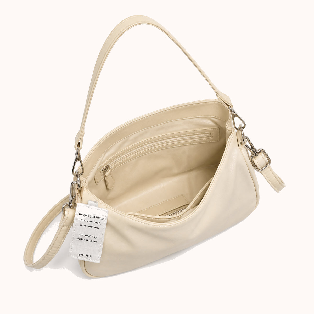 ARIPPULA FEF9F6 | butter-crescent-bag | interior | 001__butter-crescent-bag__interior.webp