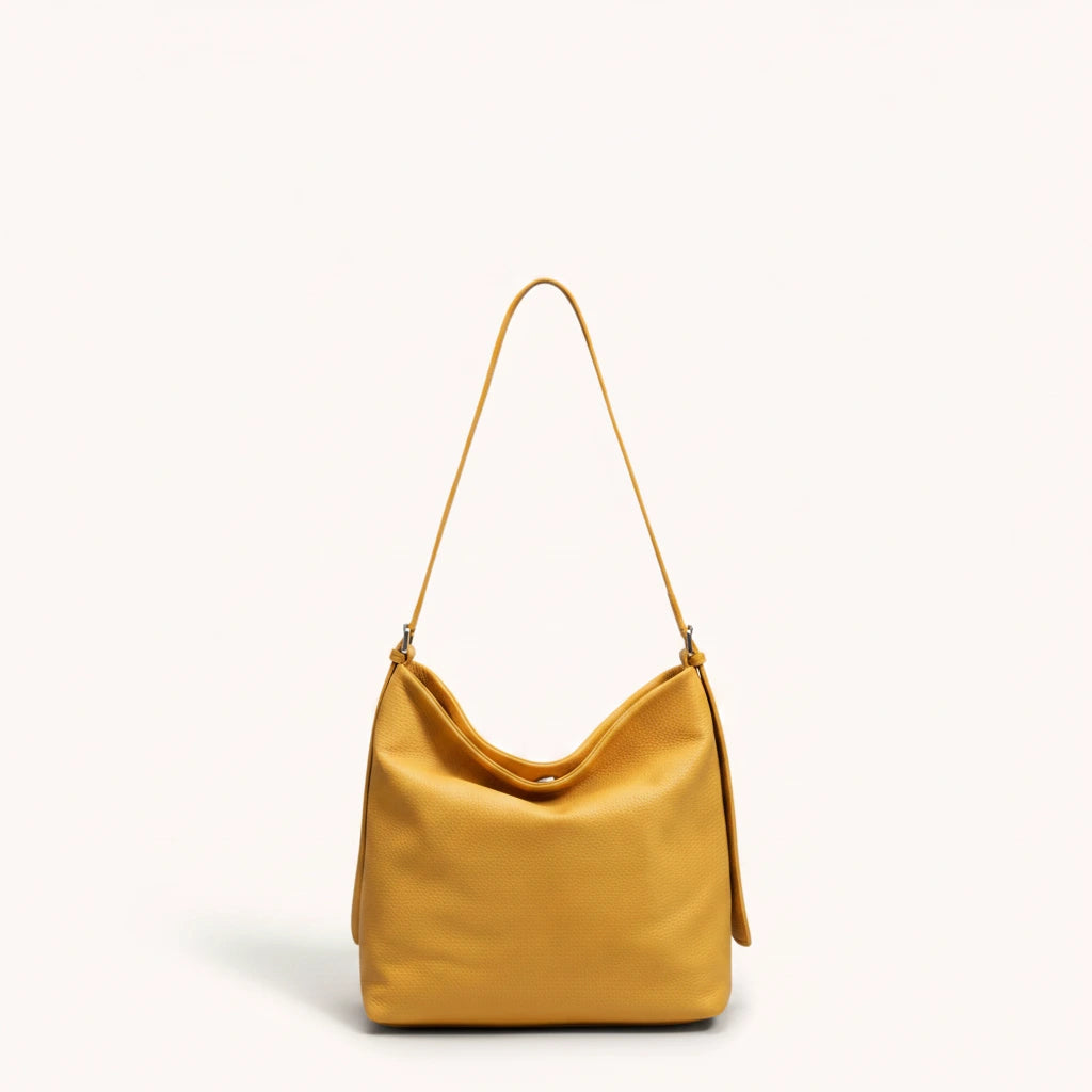 Hazel Shoulder Tote — Brushed Suede | Remove the bg with text of the products and replace the bg with image reference i give and keep the showdow of the products