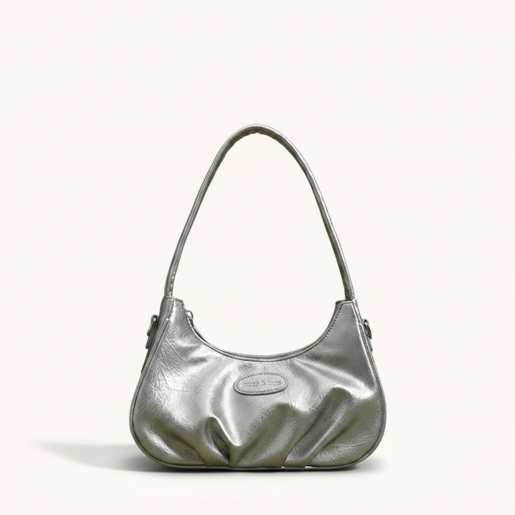 Ink Shoulder Bag — Patent | Remove the bg with text of the products and replace the bg with image reference i give and keep the showdow of the products