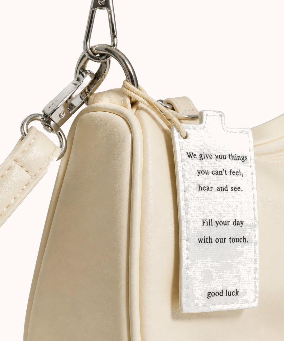 ARIPPULA FEF9F6 | butter-crescent-bag | hardware detail | 001__butter-crescent-bag__hardware-detail.webp