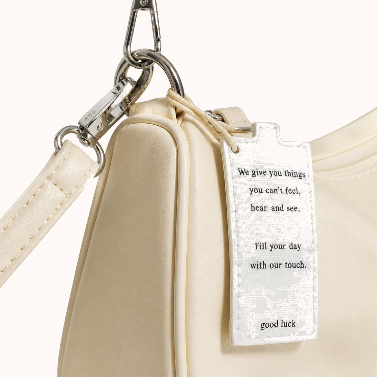 ARIPPULA FEF9F6 | butter-crescent-bag | hardware detail | 001__butter-crescent-bag__hardware-detail.webp