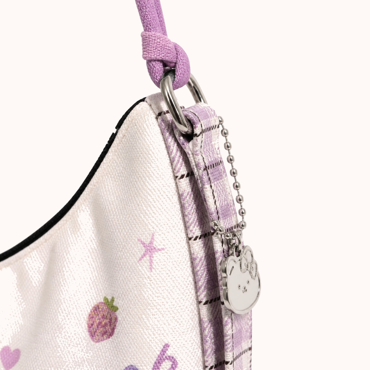 ARIPPULA FEF9F6 | berry-rain-cat-canvas-crossbody-bag | hardware detail | 020__berry-rain-cat-canvas-crossbody-bag__hardware-detail.webp