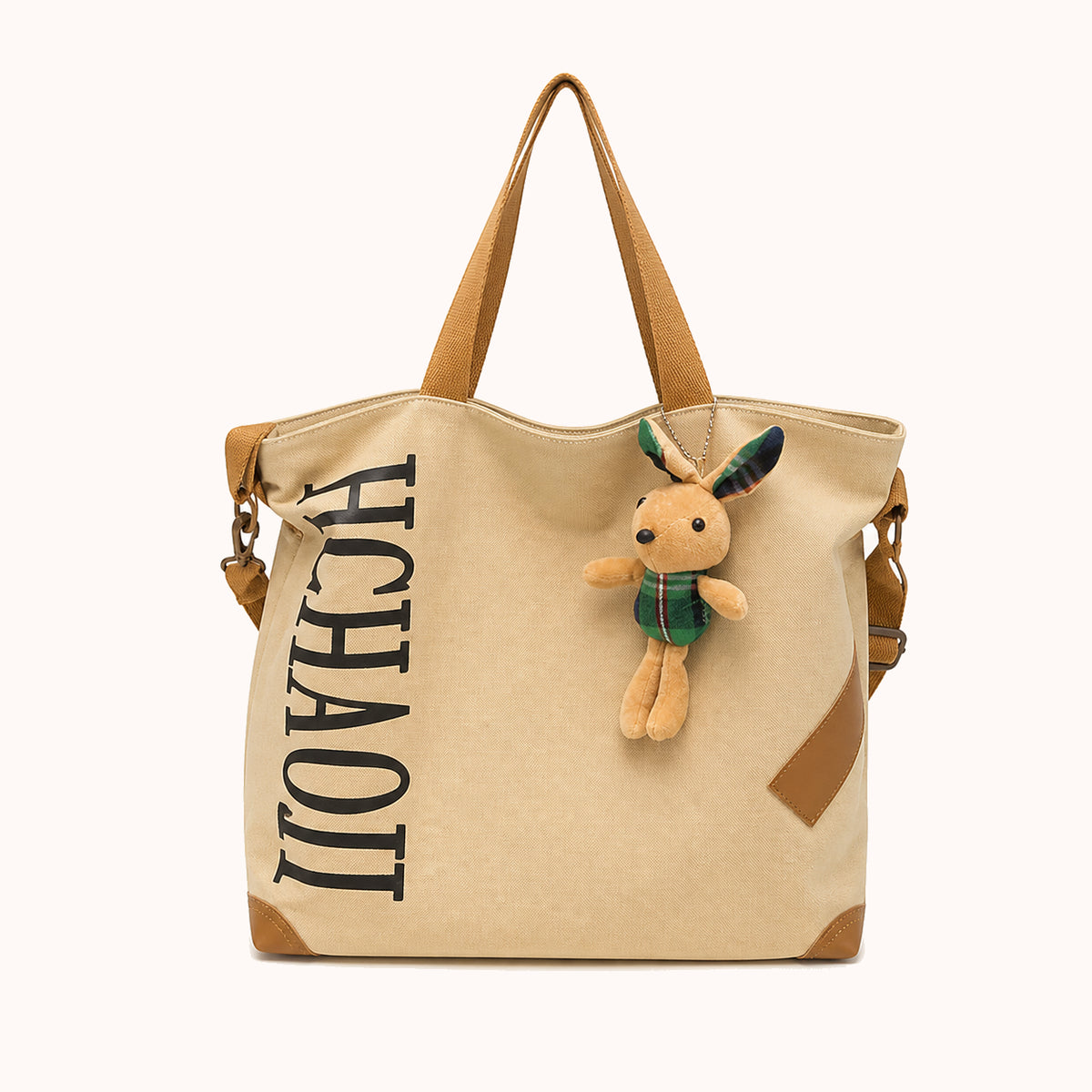 ARIPPULA FEF9F6 | fern-canvas-tote | close quality | 051__fern-canvas-tote__brown-charm__front.webp