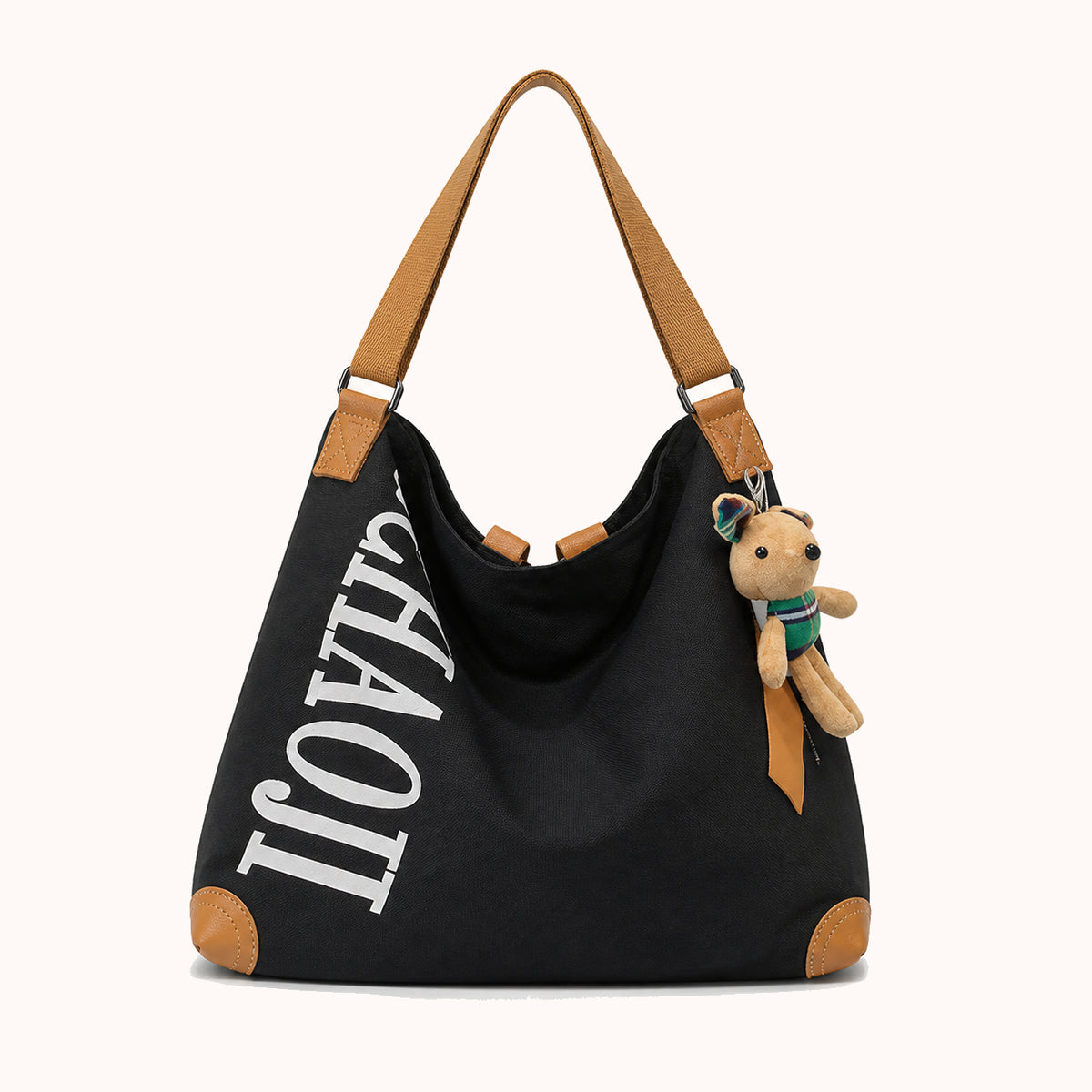 ARIPPULA FEF9F6 | fern-canvas-tote | close quality | 052__fern-canvas-tote__black-charm__front.webp