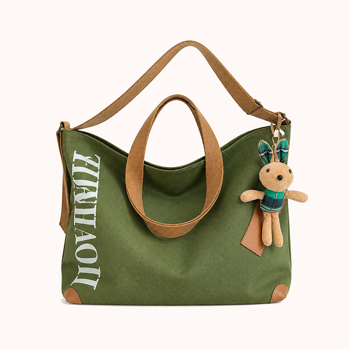 ARIPPULA FEF9F6 | fern-canvas-tote | close quality | 053__fern-canvas-tote__green-charm__front.webp