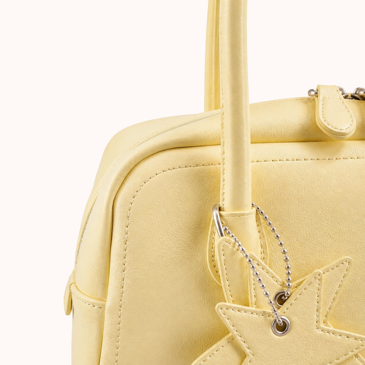 ARIPPULA FEF9F6 | primrose-smooth-handbag | hardware detail | 107__primrose-smooth-handbag__hardware-detail.webp