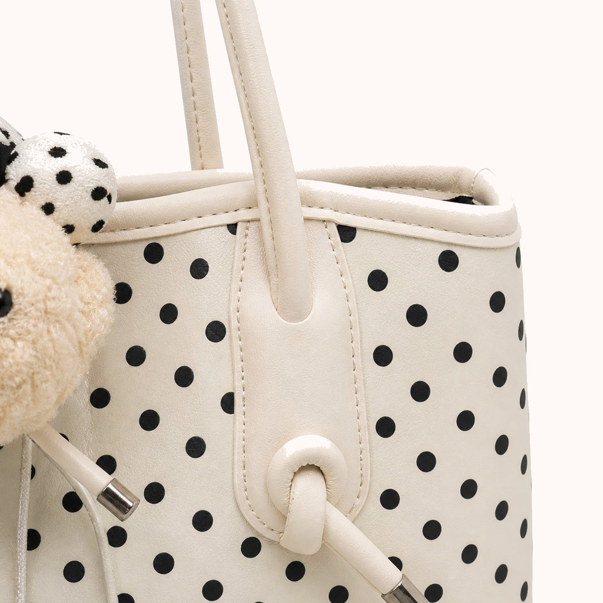 ARIPPULA FEF9F6 | dalmatian-polka-dot-tote | hardware detail | 116__dalmatian-polka-dot-tote__hardware-detail.webp