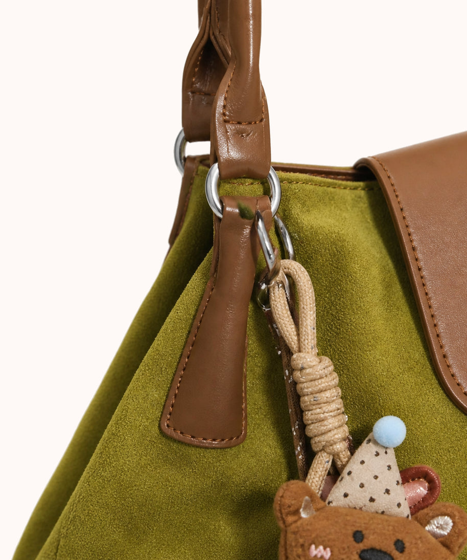 ARIPPULA FEF9F6 | olive-suede-tote | hardware detail | 127__olive-suede-tote__hardware-detail.webp