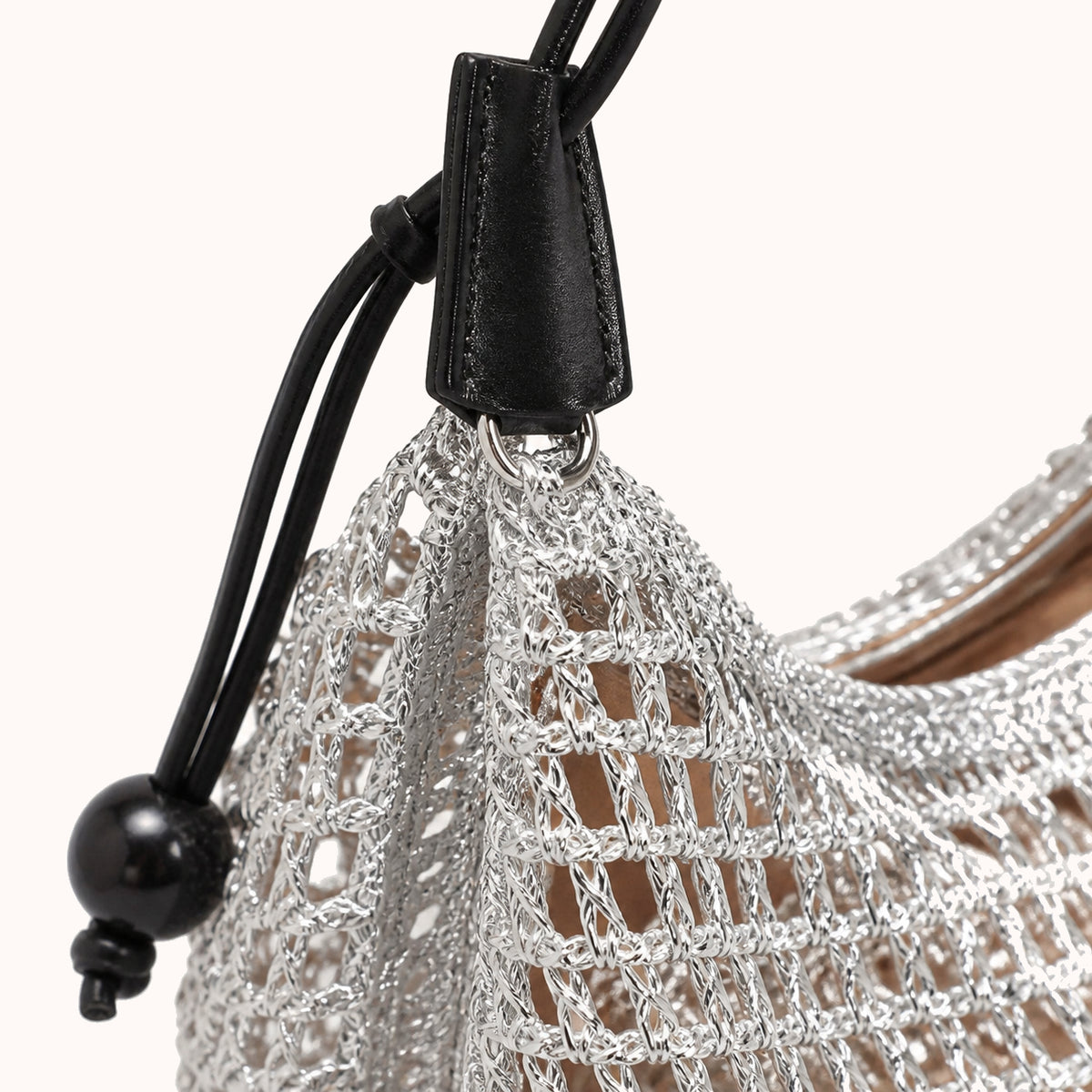 ARIPPULA FEF9F6 | trellis-woven-shoulder-bag | hardware detail | 140__trellis-woven-shoulder-bag__hardware-detail.webp