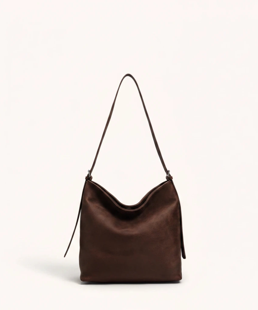 Hazel Shoulder Tote — Brushed Suede | Remove the bg with text of the products and replace the bg with image reference i give and keep the showdow of the products