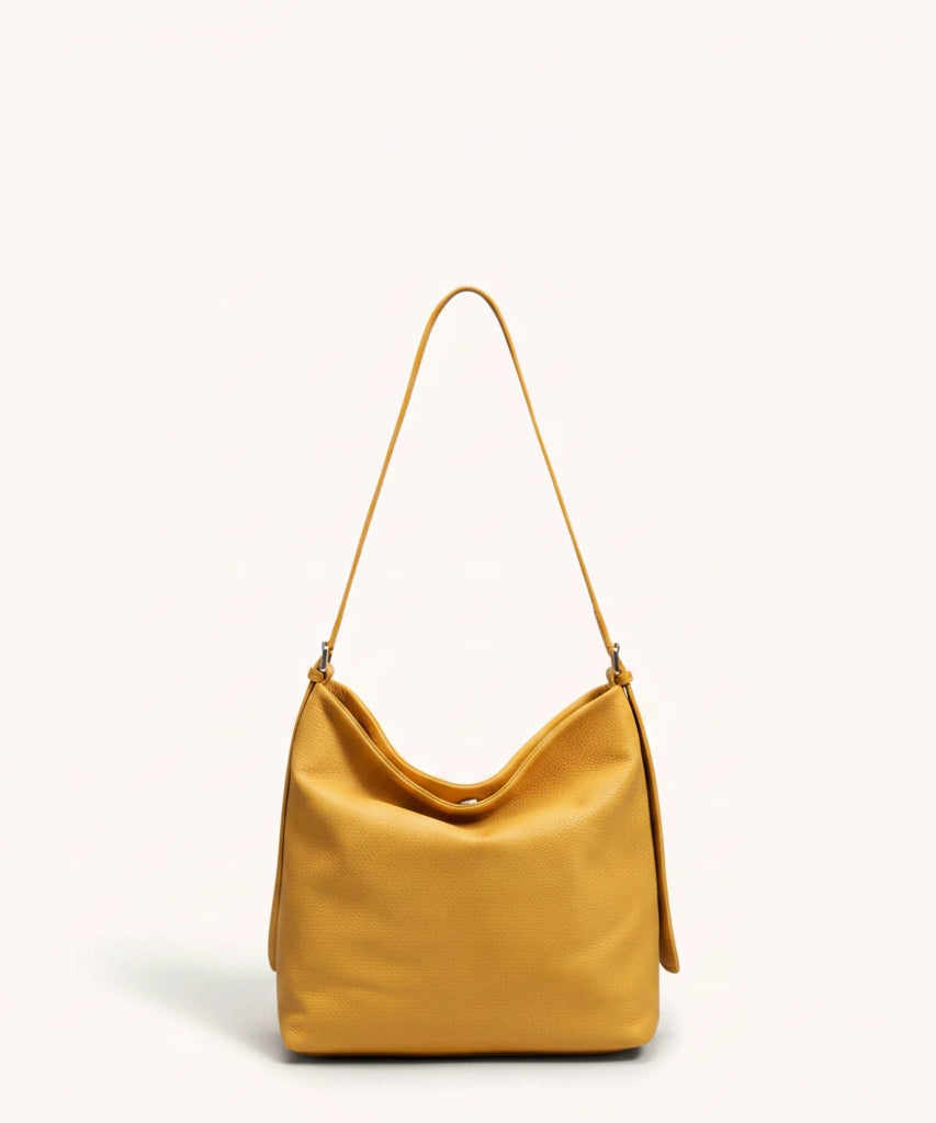Hazel Shoulder Tote — Brushed Suede | Remove the bg with text of the products and replace the bg with image reference i give and keep the showdow of the products