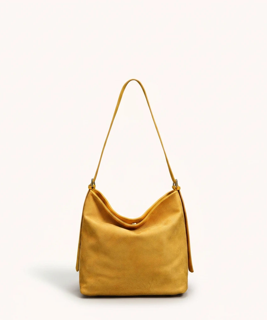 Hazel Shoulder Tote — Brushed Suede | Remove the bg with text of the products and replace the bg with image reference i give and keep the showdow of the products