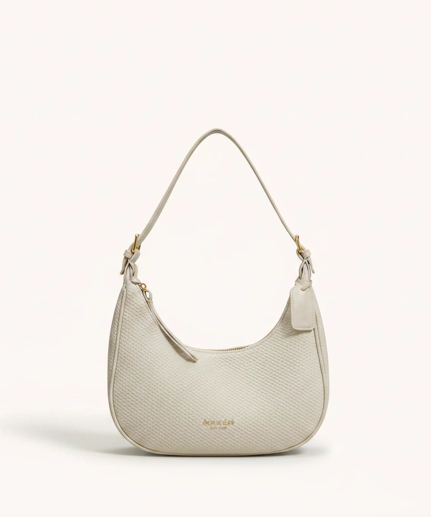 Moon Shoulder Bag — Pebbled | Remove the bg with text of the products and replace the bg with image reference i give and keep the showdow of the products