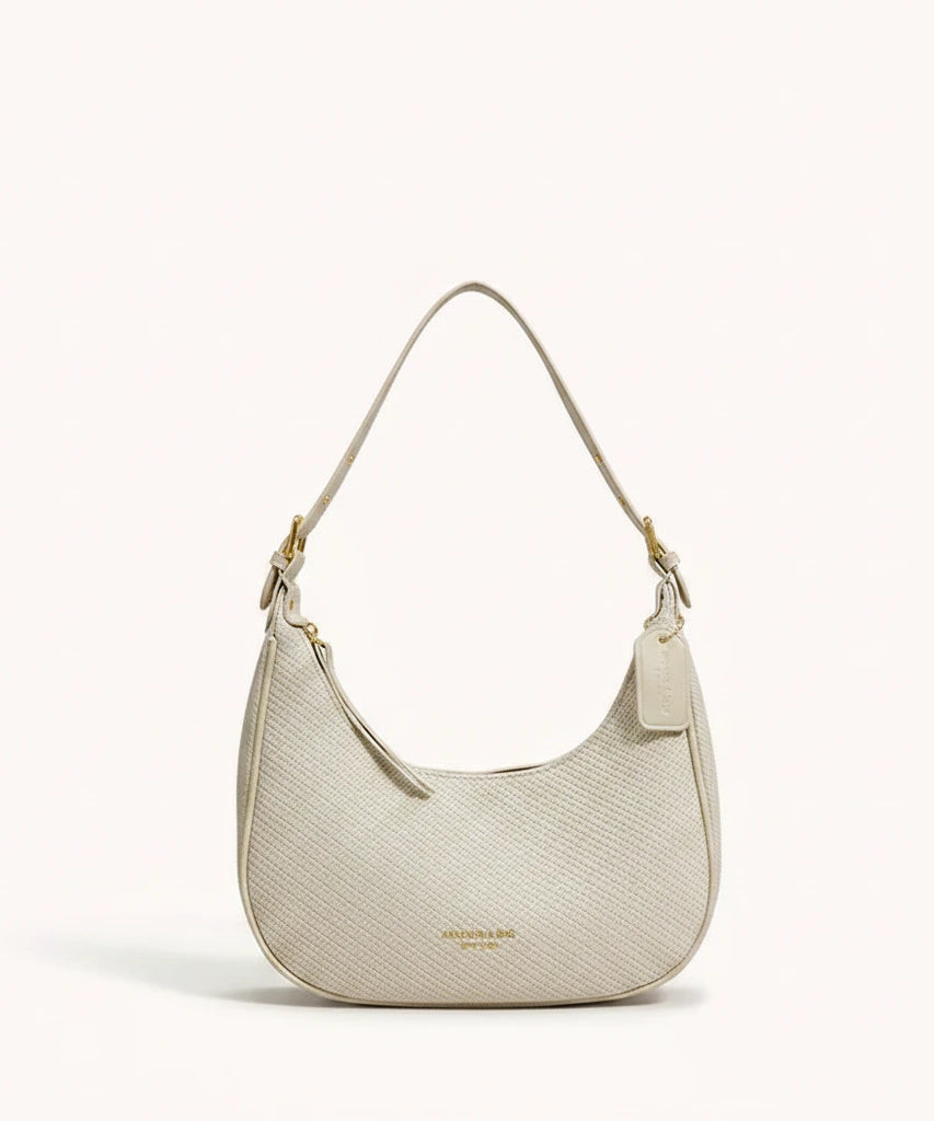 Moon Shoulder Bag — Pebbled | Remove the bg with text of the products and replace the bg with image reference i give and keep the showdow of the products