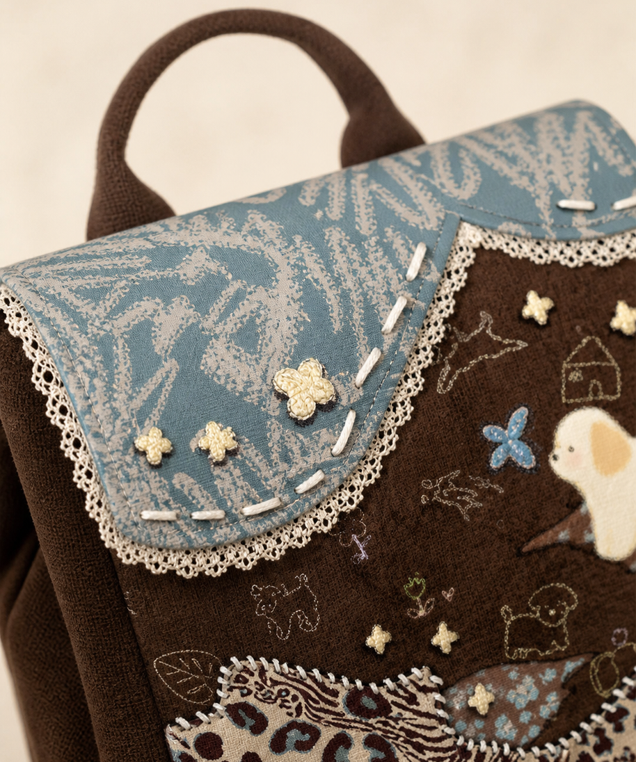 Caramel Puppy Canvas Flap Backpack — flap and lace detail