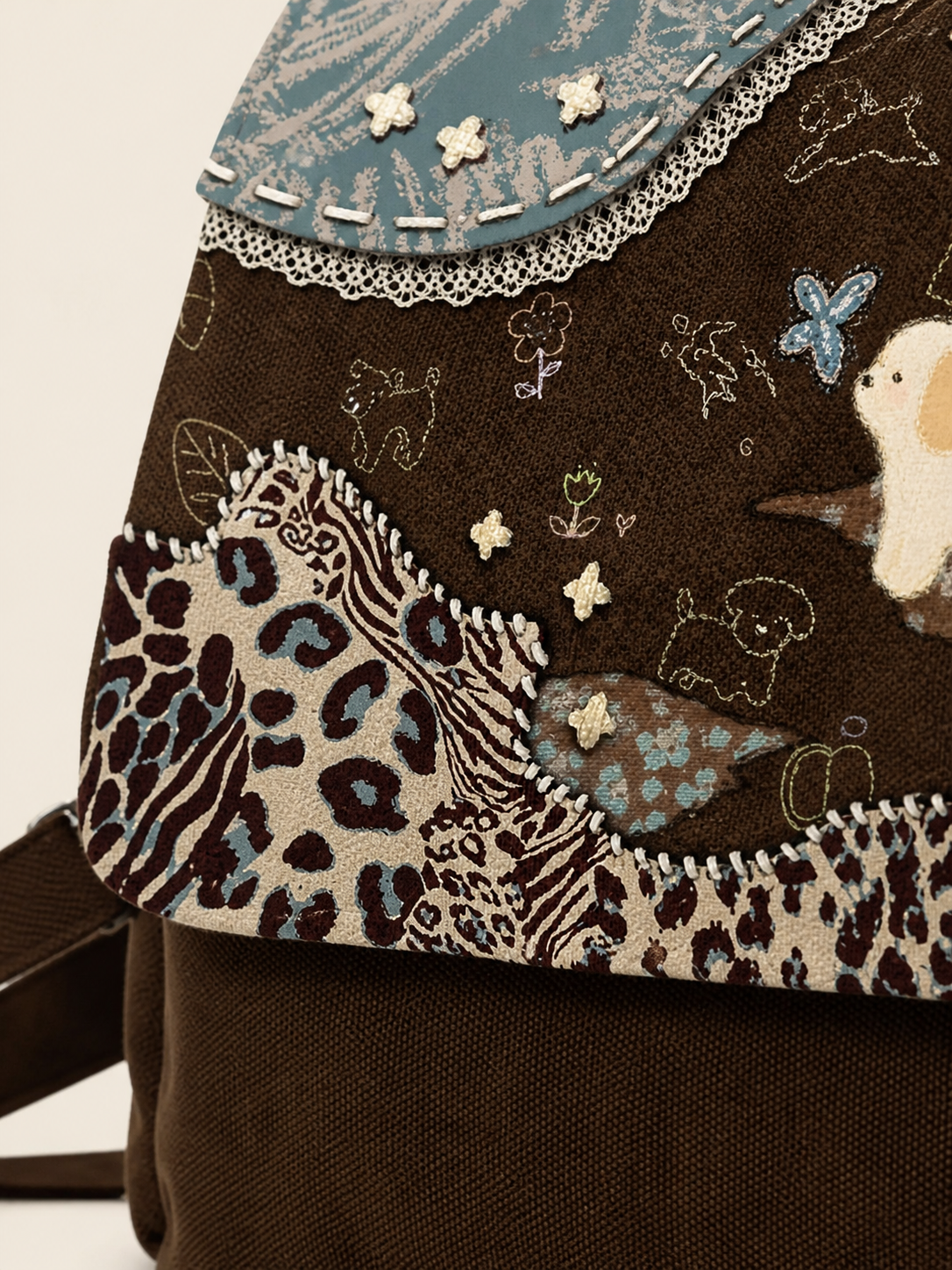 Caramel Puppy Canvas Flap Backpack — patchwork detail