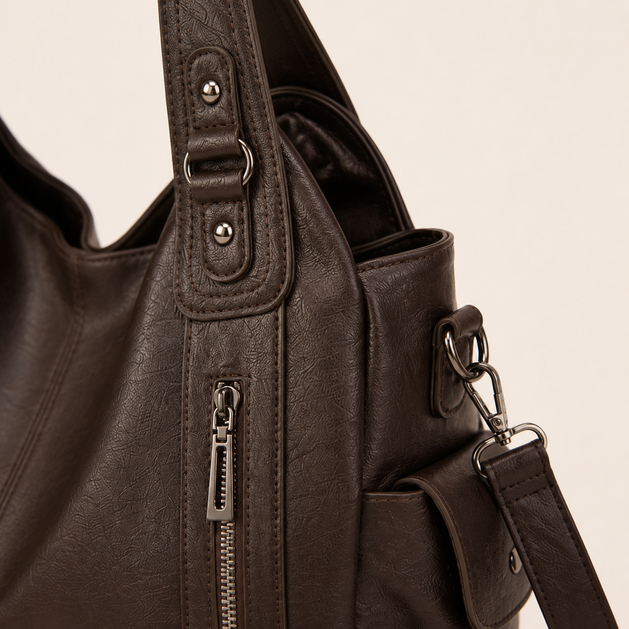 Harper tote vertical zipper, handle and strap hardware detail