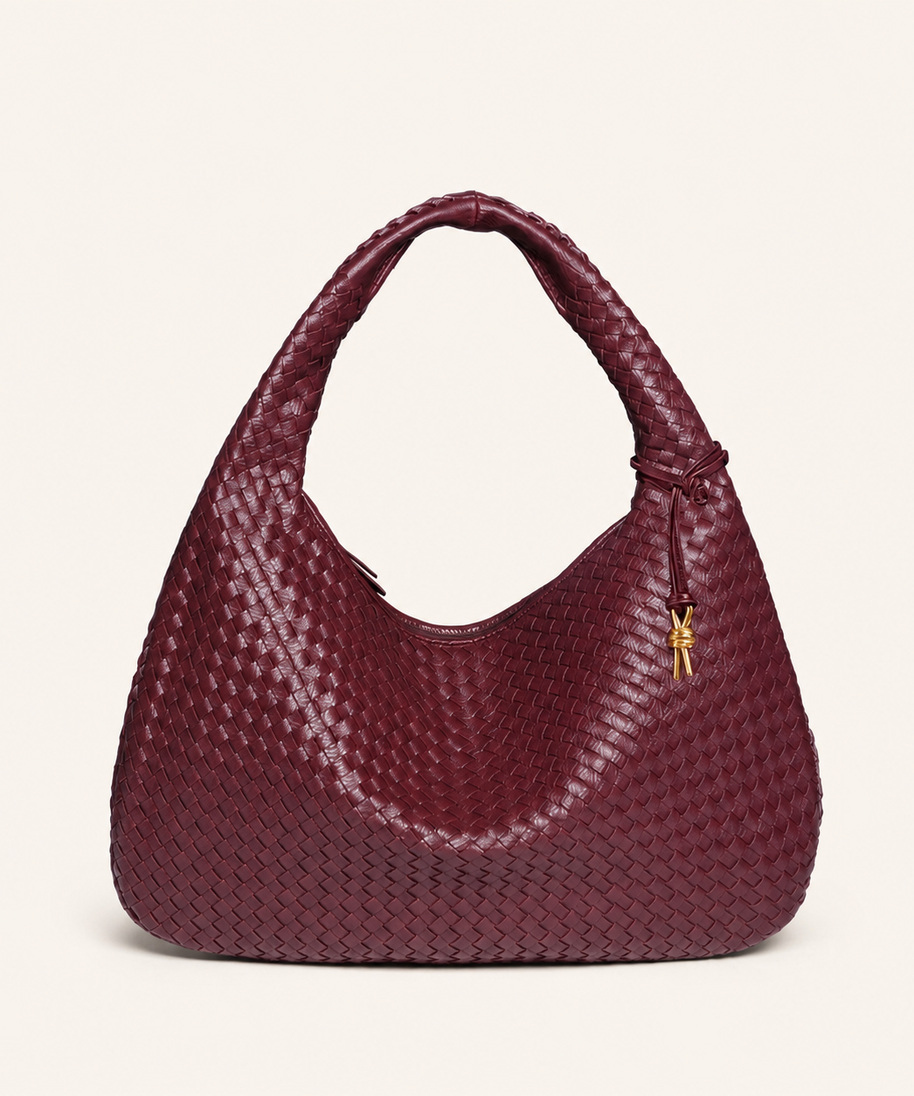 Sienna Woven Crescent Shoulder Bag front view on warm ivory background