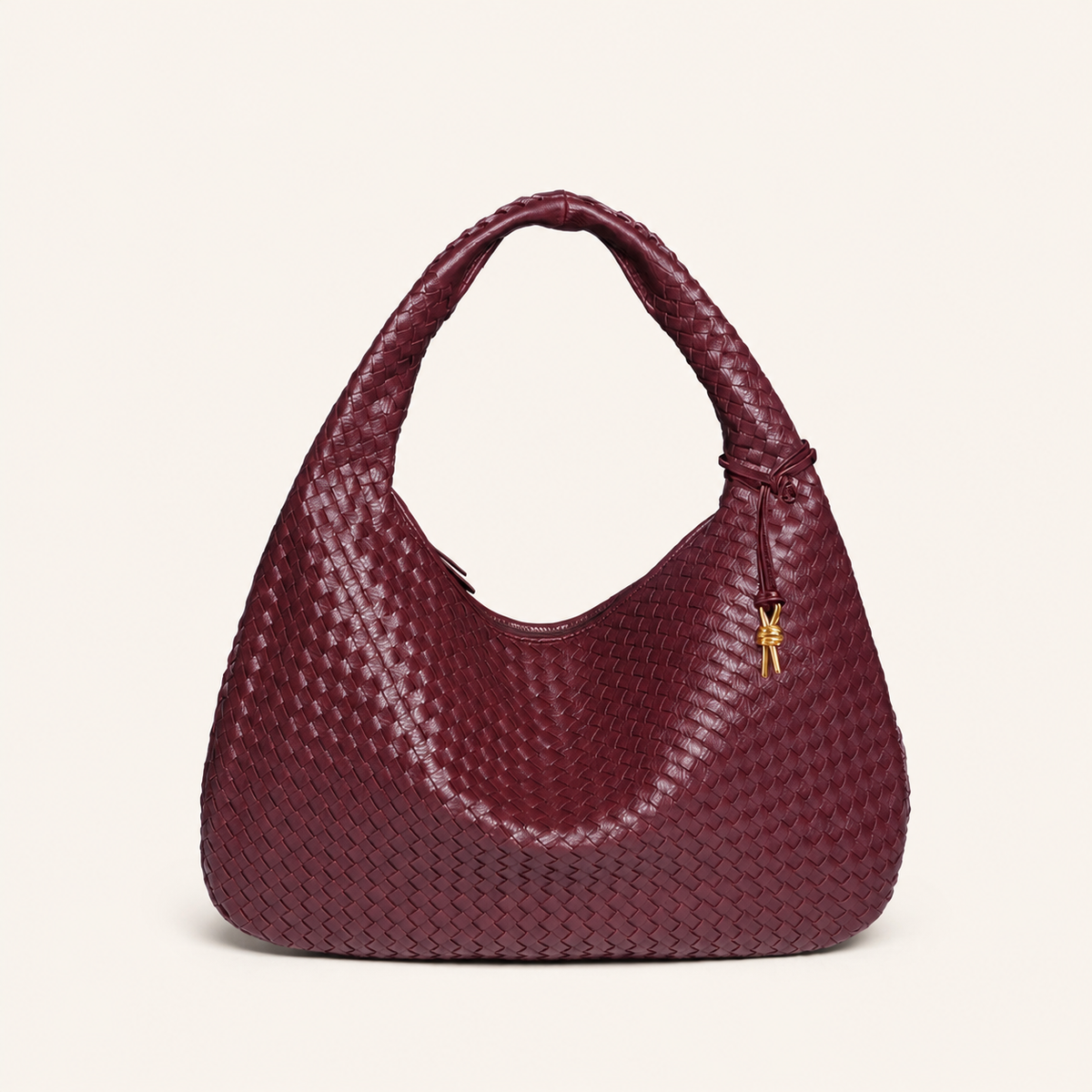 Sienna Woven Crescent Shoulder Bag front view on warm ivory background