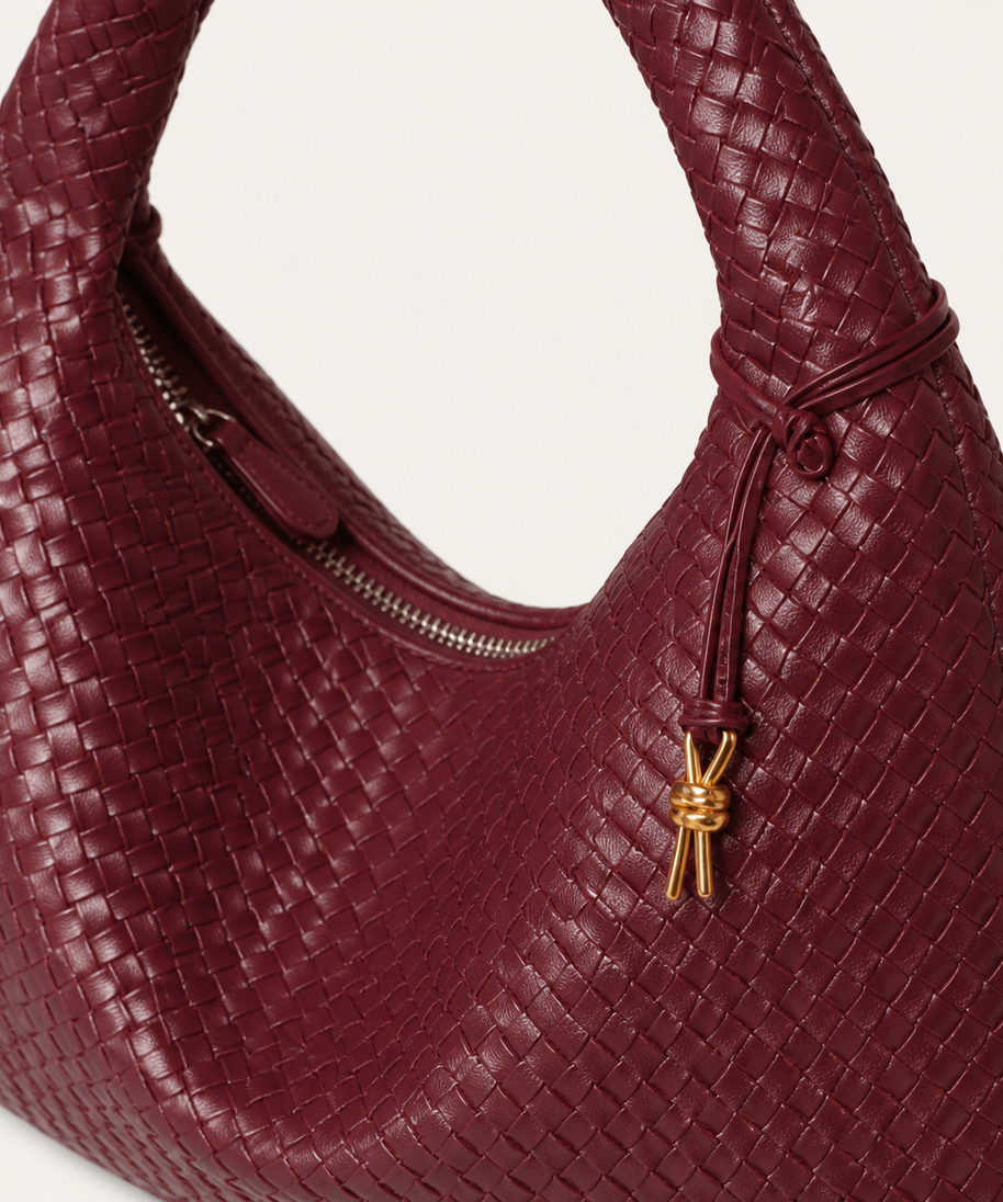 Sienna woven bag braided handle, zipper and gold charm detail