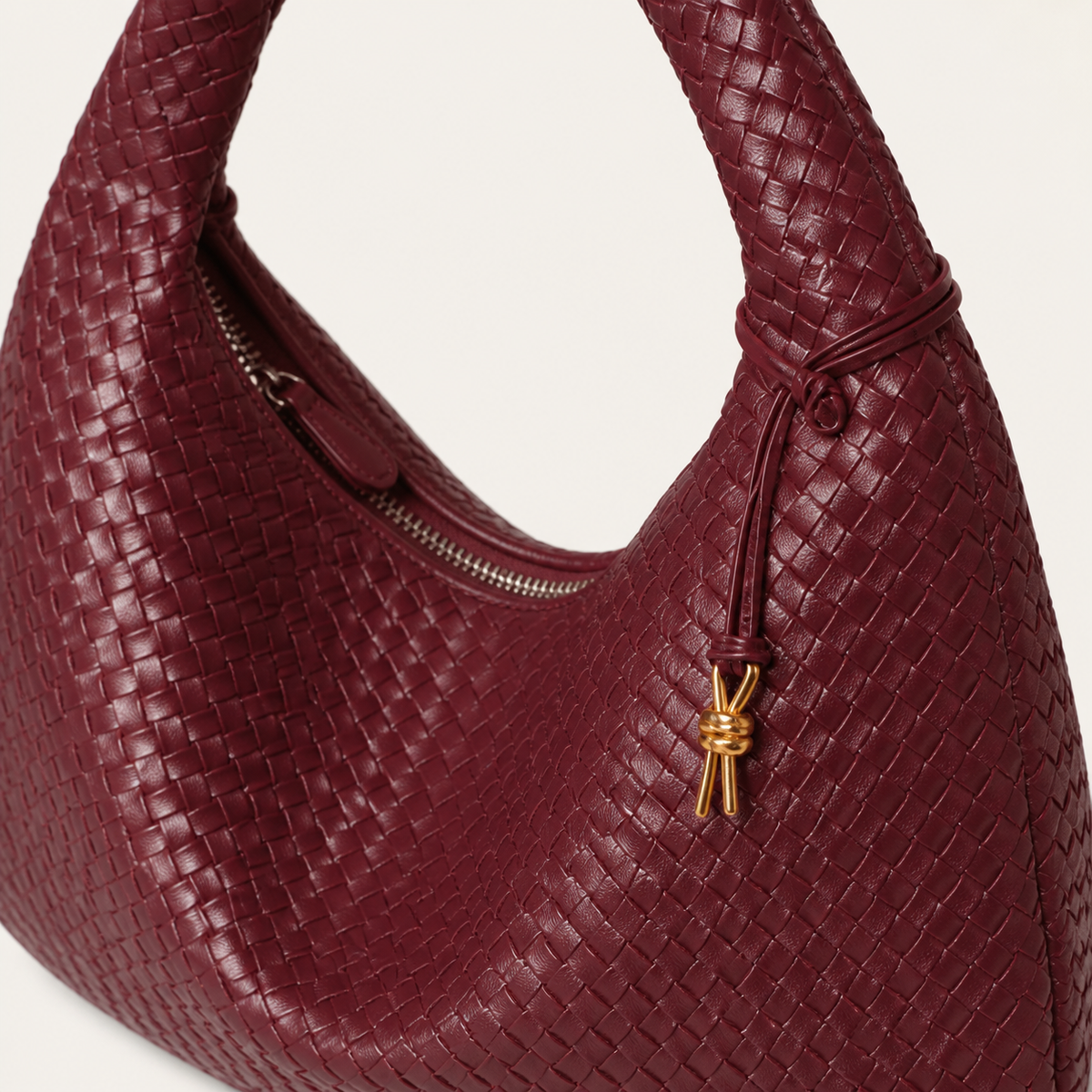Sienna woven bag braided handle, zipper and gold charm detail